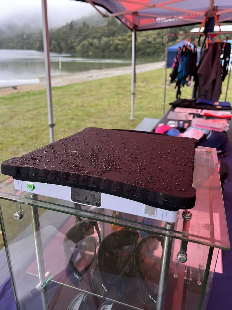 A Starlink Mini on a display stand at a market stall
